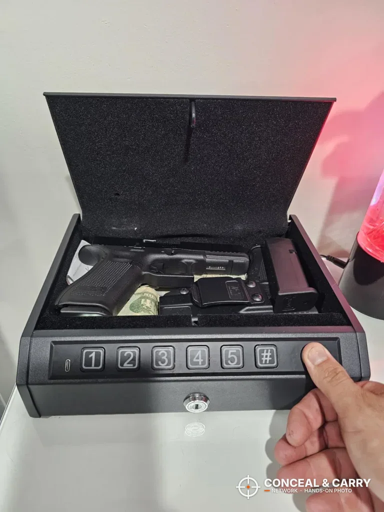 AIRMuch biometric 3-pistol safe open with a pistol and magazine inside