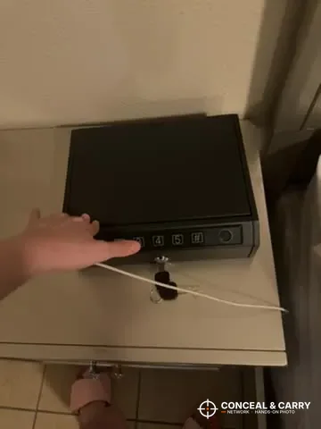 AIRMuch gun safe on a nightstand shelf with the security cable