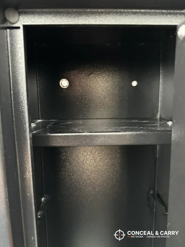 Removable shelf near the top of the empty Barska rifle safe