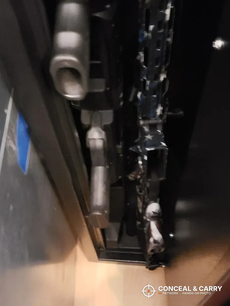 Looking down into the Barska rifle safe with guns standing inside