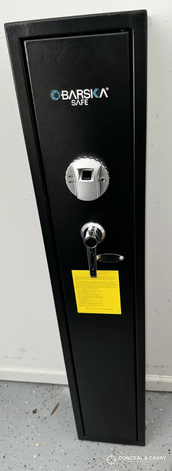 Barska biometric rifle safe standing closed, front view with fingerprint reader and key lock