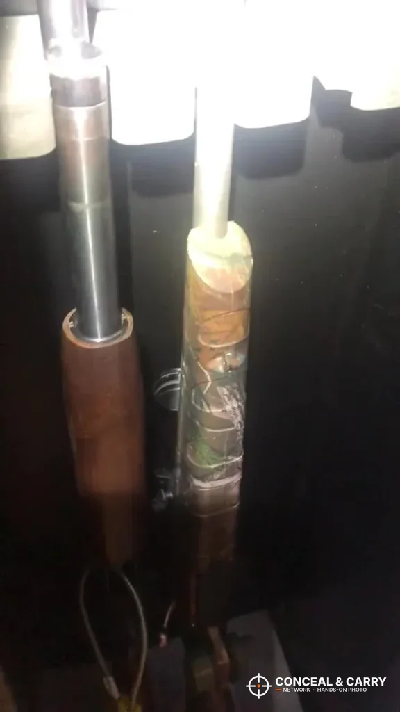 Two long-gun barrels standing in the barrel rest inside the BBRKIN rifle safe