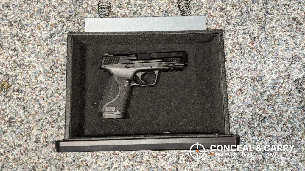 Pistol lying in the foam-lined drawer of the BBRKIN Slide-Away safe