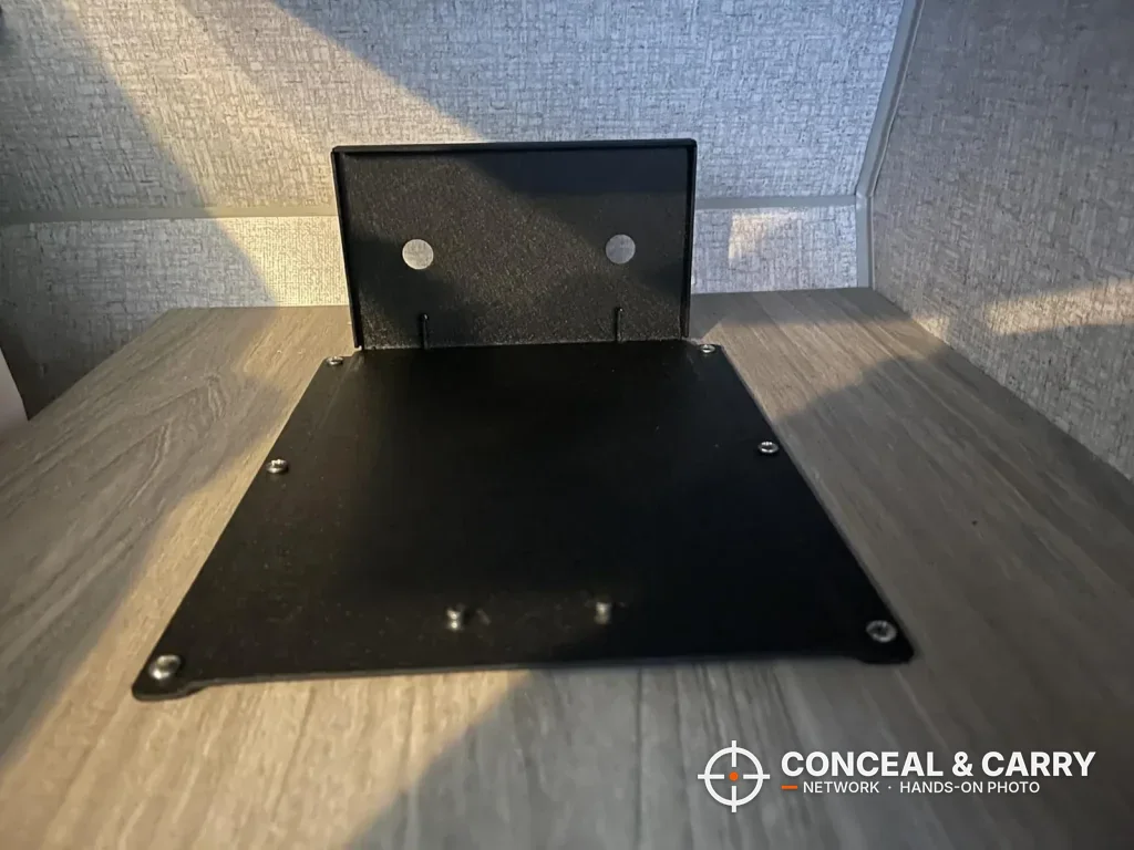 Black metal plate screwed to a wooden shelf for the BBRKIN Slide-Away safe