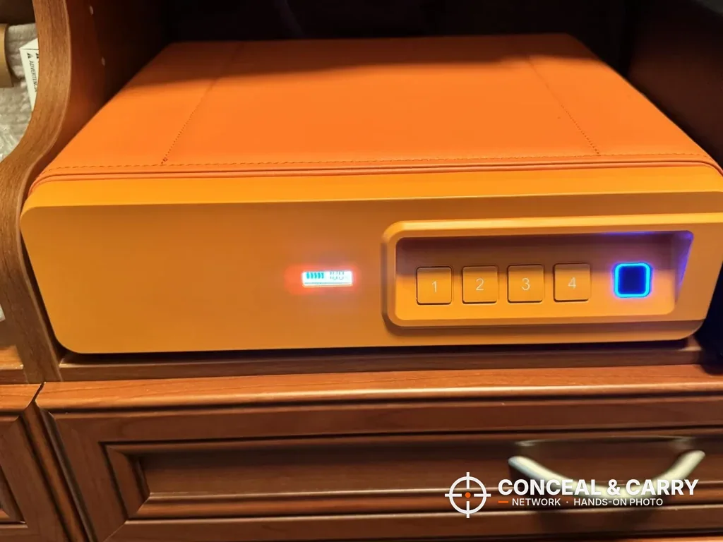 Orange BBRKIN Slide-Away safe with the fingerprint reader lit blue