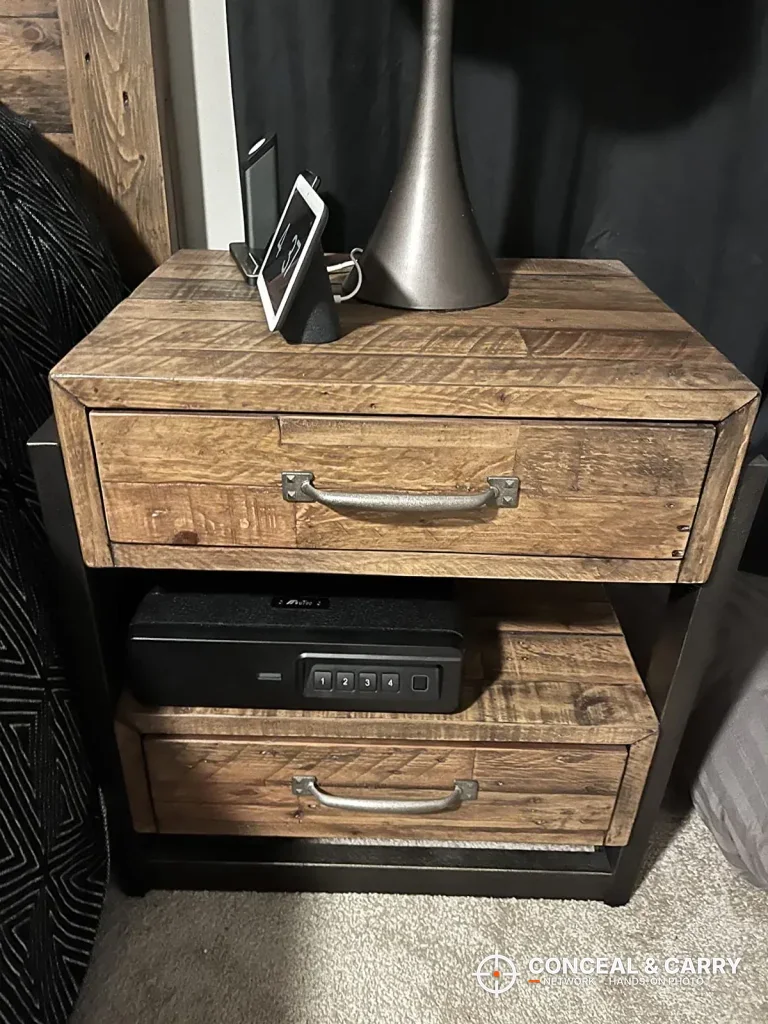 BBRKIN Slide-Away safe on the lower shelf of a wooden nightstand