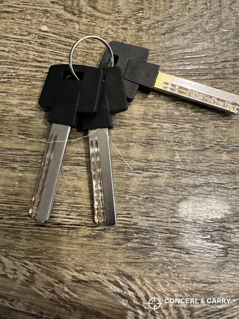 Two BE-TECH lock box backup keys on a ring