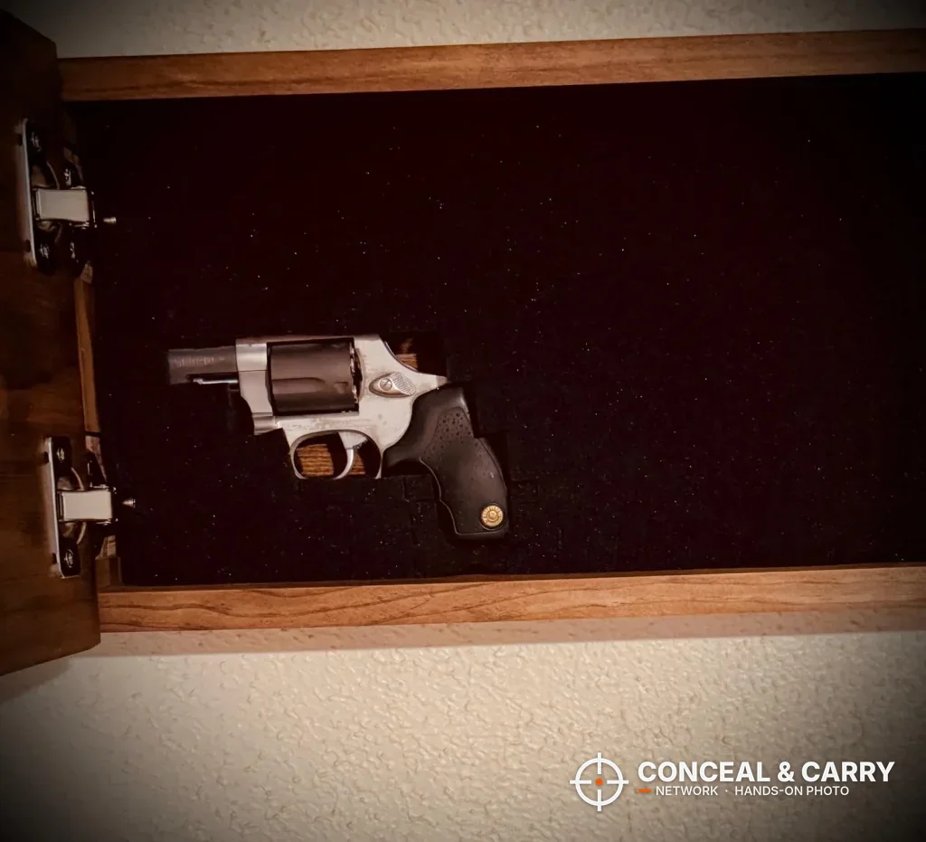 Bellewood hidden gun safe sign open with a revolver held in the foam insert