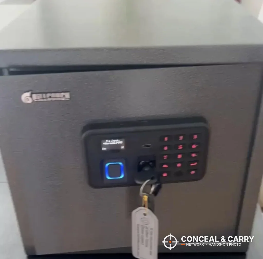 Billconch multi-pistol safe front panel lit up with the key in the lock