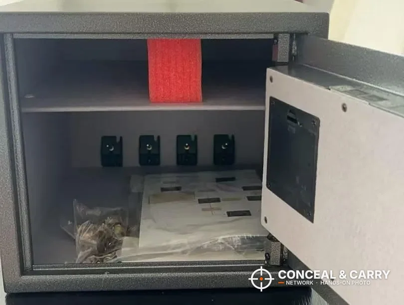 Billconch multi-pistol safe open with the manual and hardware bag inside