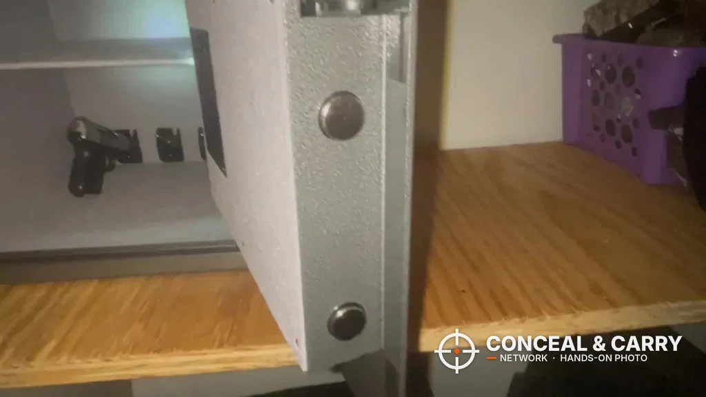 Billconch multi-pistol safe door open showing two locking bolts on the edge