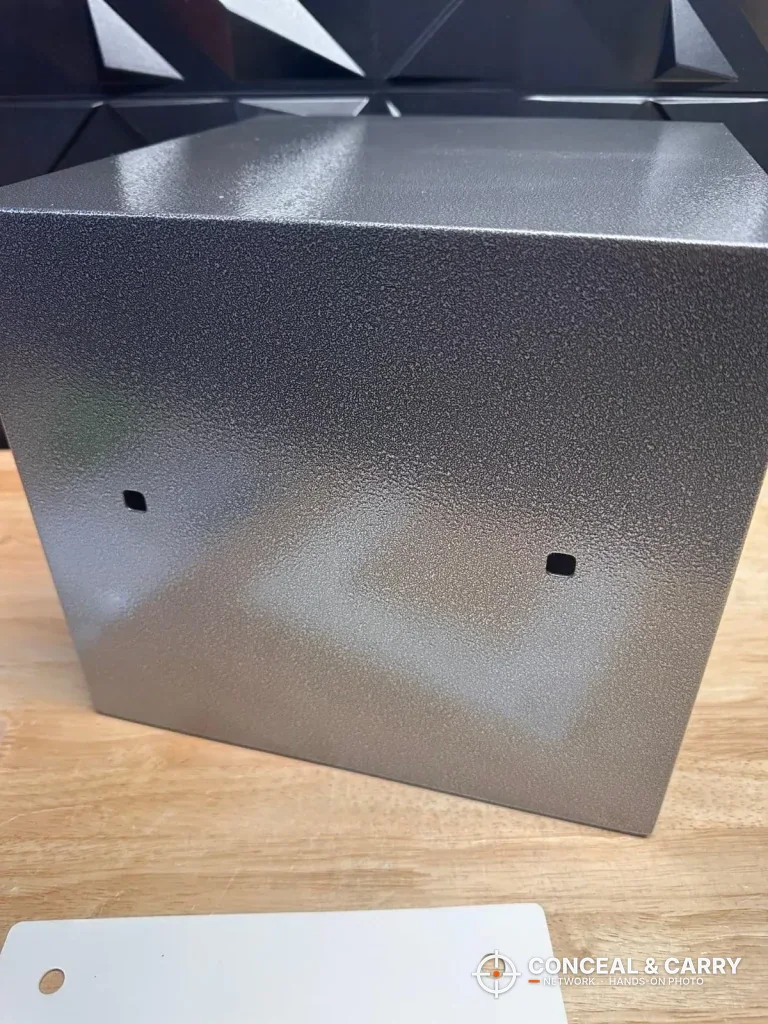 Outside panel of the Billconch multi-pistol safe with two holes