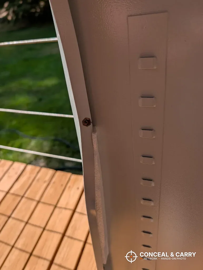 Row of slots stamped into a Bonusall gun safe panel