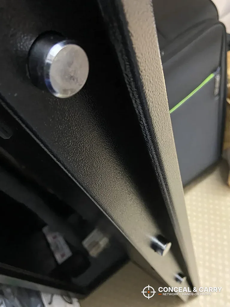 Edge of the Bonusall rifle safe door with its textured black finish