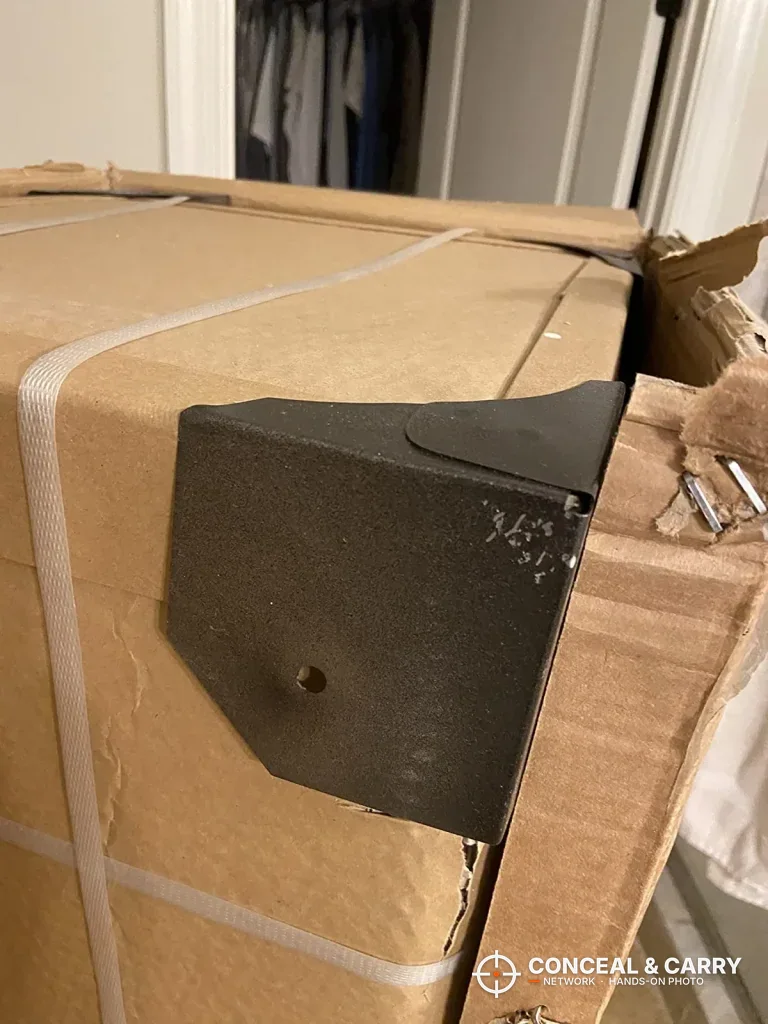 Black steel panel of the Bonusall rifle safe coming out of its carton