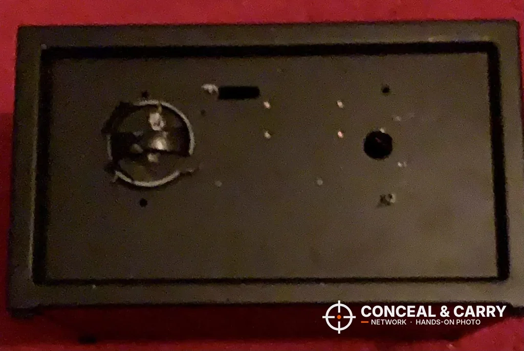 Bulldog BD1050 door panel on a red cloth with the lock parts showing