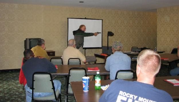 Demonstrating the draw from concealment — grip and stance