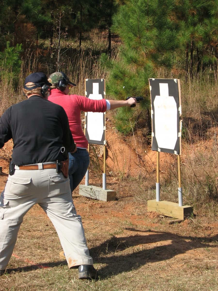 Coaching a student shooting on the move, Defensive Shooting class