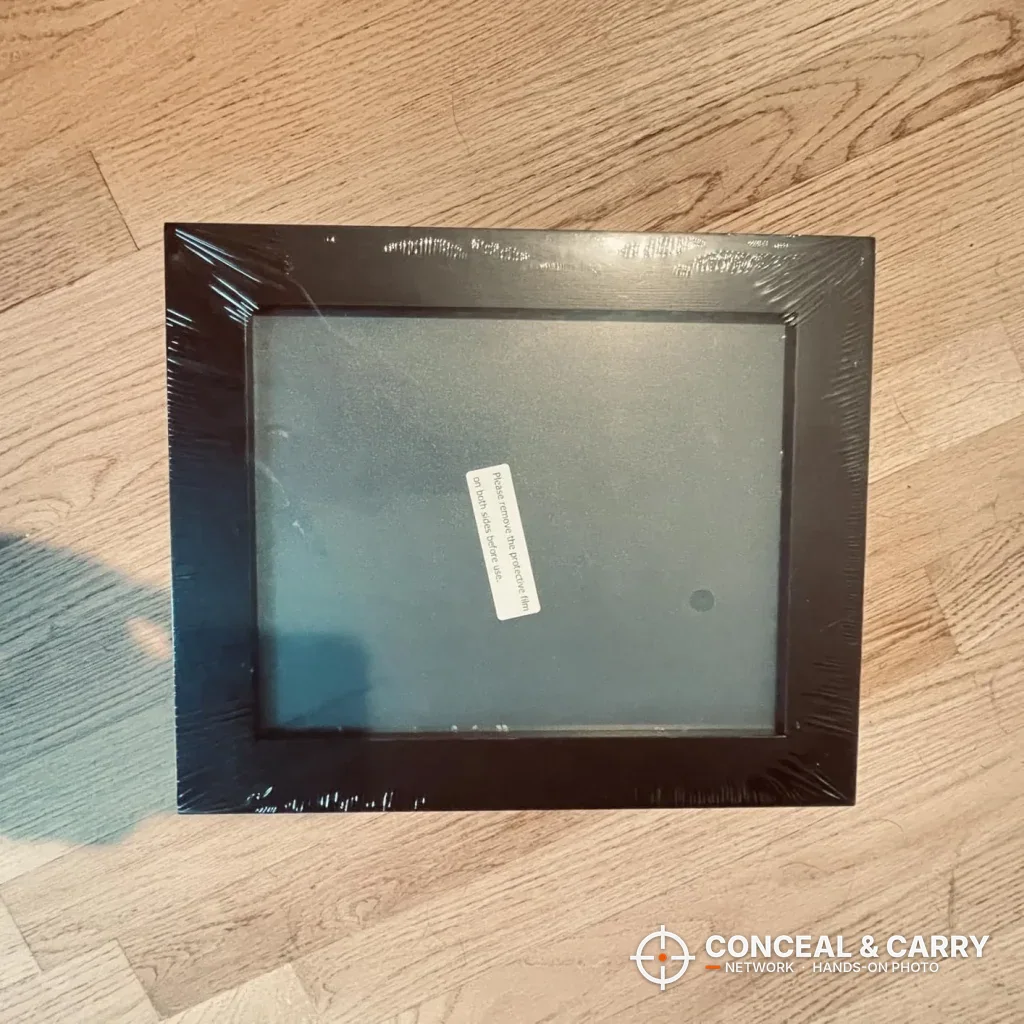Dononr hidden gun storage shelf still in its plastic wrap on a wood floor