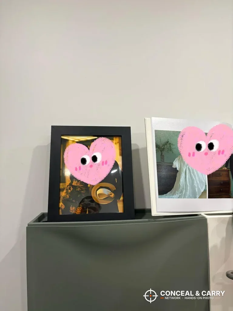 Dononr frame with a picture in the front, standing beside another photo