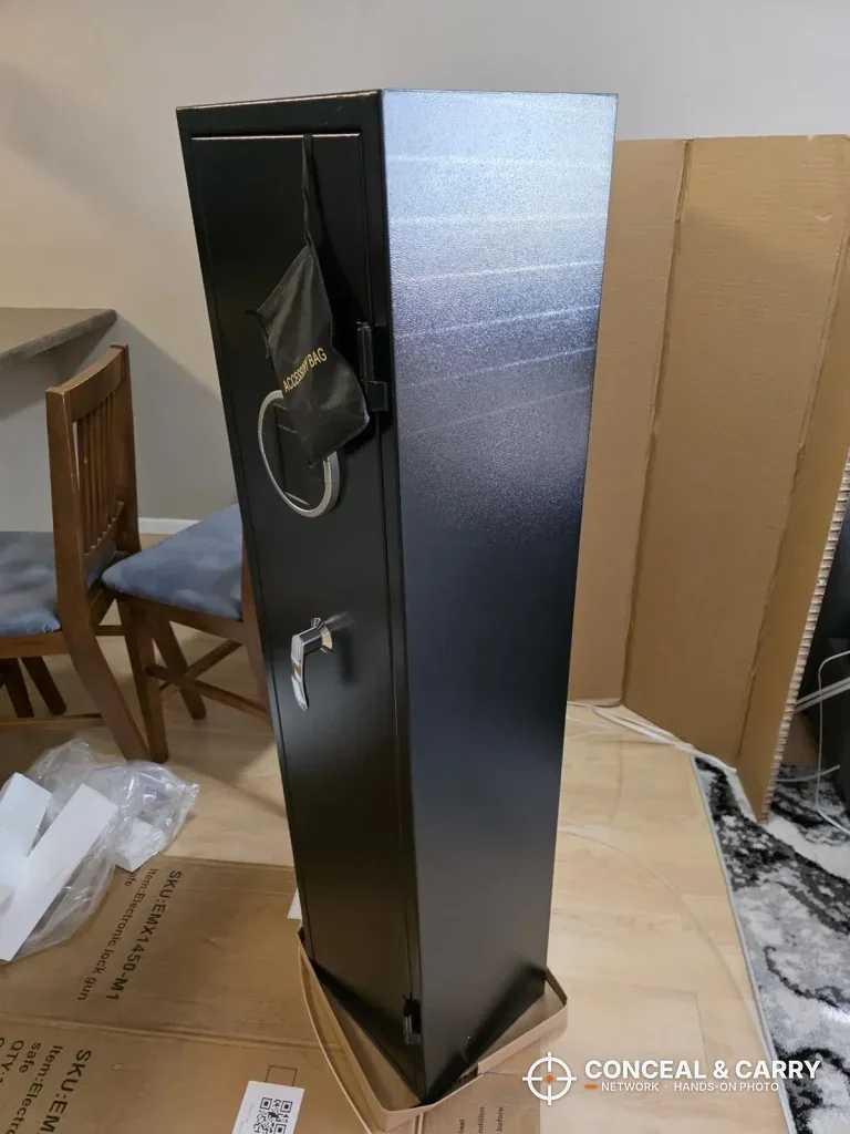 EMAXEE gun cabinet closed, angled view with the tag hanging from the front panel