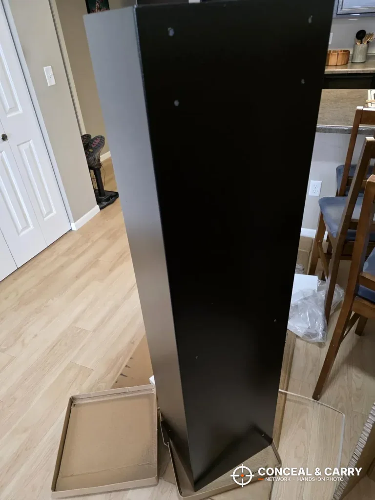 Side and back of the EMAXEE gun cabinet standing on its shipping base