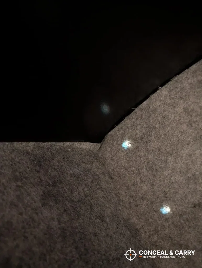 Small LED lights glowing against the felt inside the EMAXEE cabinet