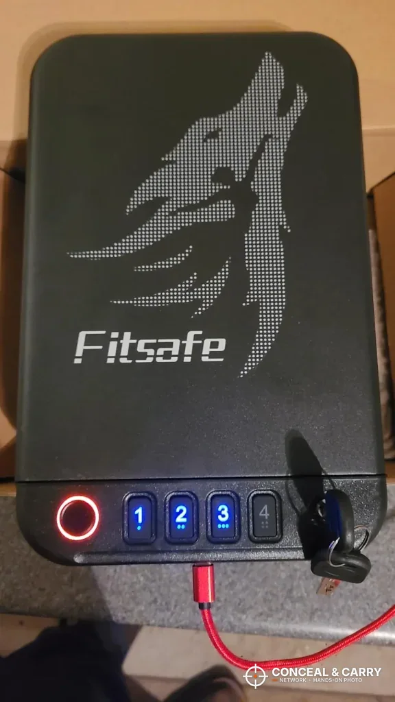 Fitsafe biometric safe closed with the fingerprint reader lit red and the keypad lit blue