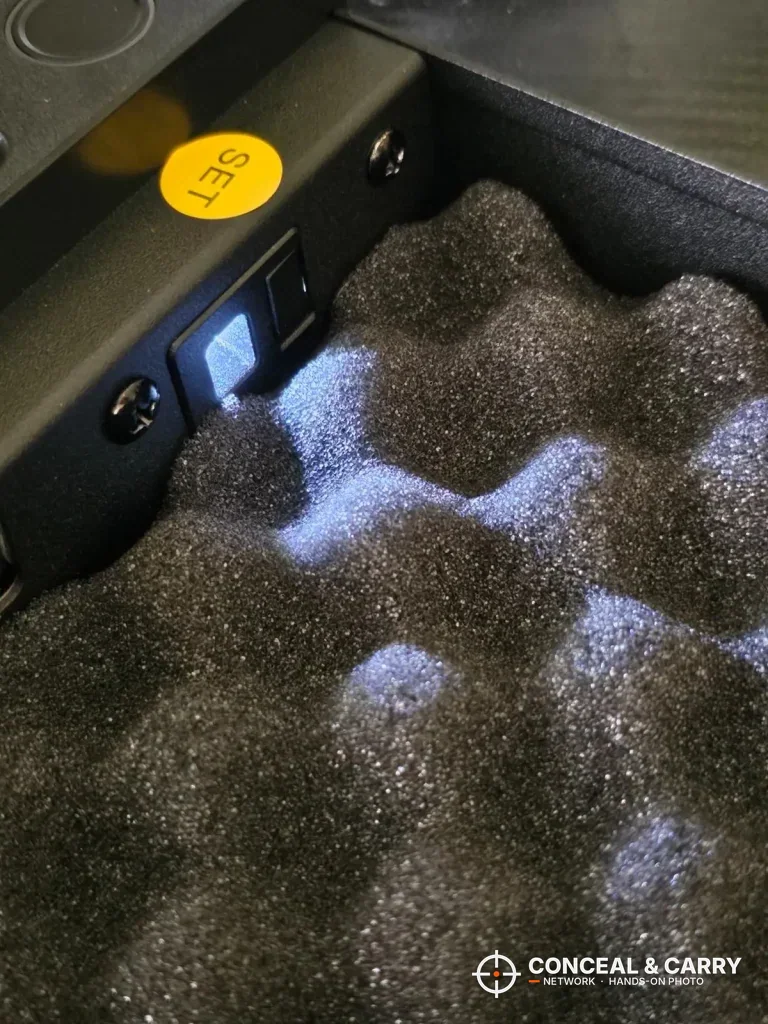 Fitsafe safe interior light on the foam beside the yellow SET button