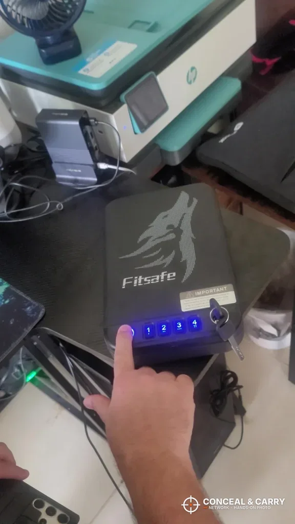 Hand pressing the lit keypad on the Fitsafe safe