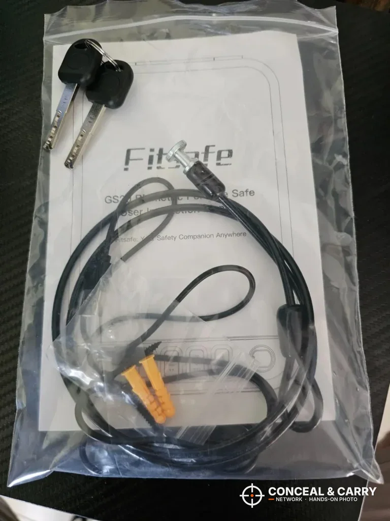 Fitsafe backup keys and security cable in a plastic bag