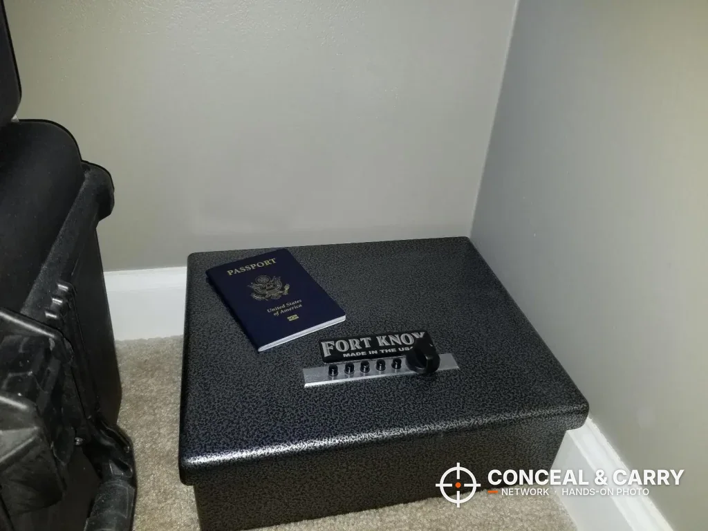 Closed Fort Knox PB1 on the floor with a passport on the lid for size