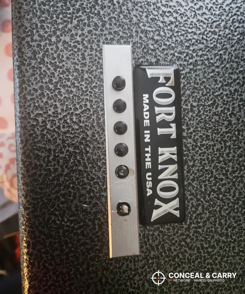 Vertical close-up of the Fort Knox PB1 pushbutton column and badge
