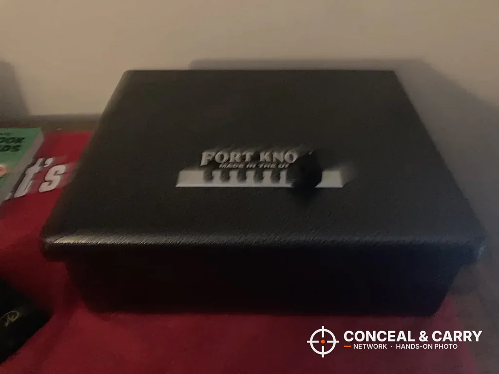 Fort Knox PB1 pistol box closed on a red tabletop