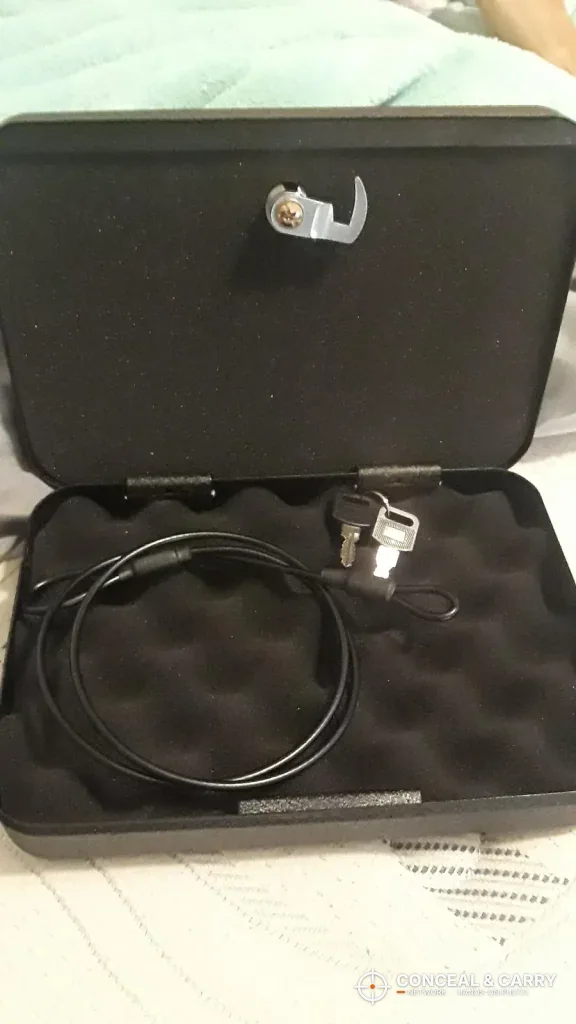 FSDC MLC5200 open with two keys and a looped steel cable on the foam