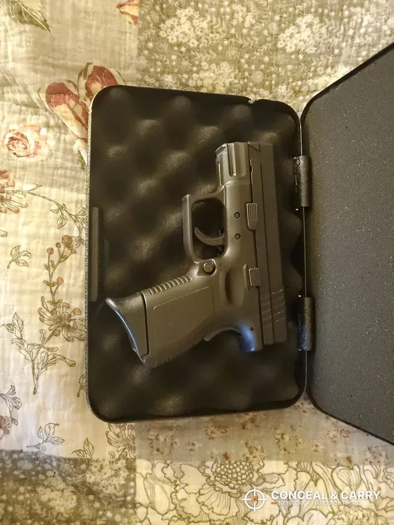 Compact pistol on the egg-crate foam in the open FSDC lock box
