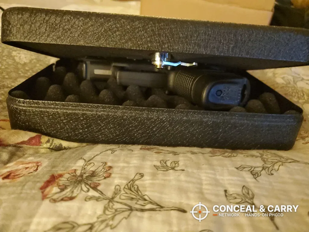 FSDC lock box lid lifted to show the latch hook over the egg-crate foam