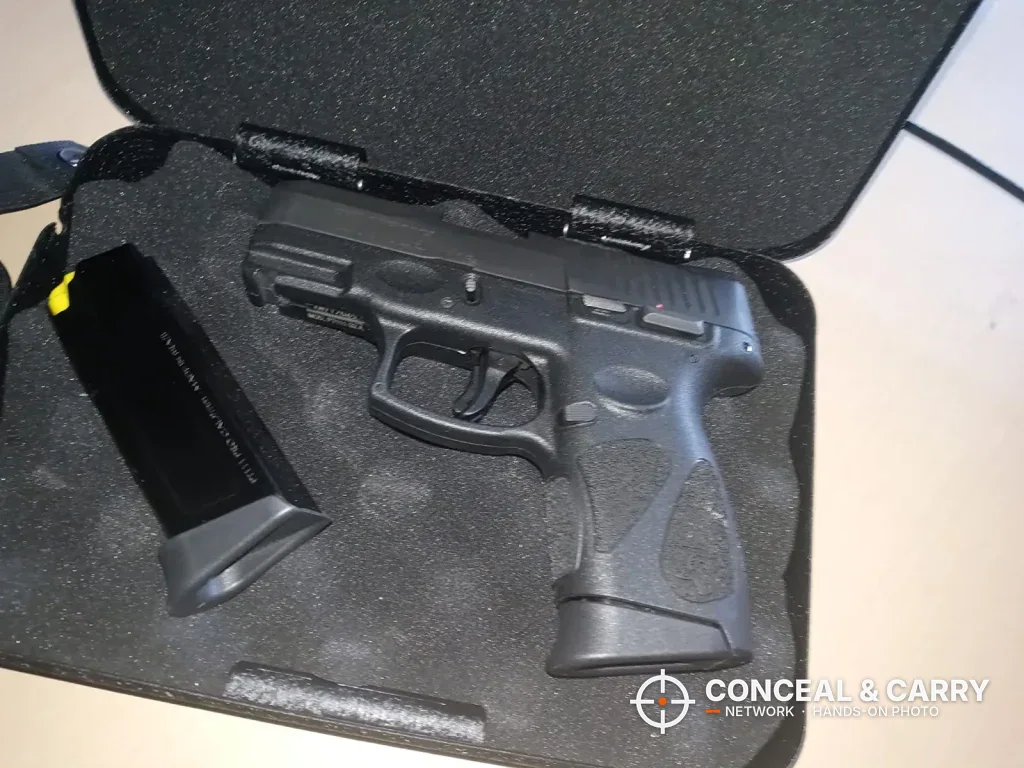 Compact pistol and spare magazine on the flat foam in the FSDC case