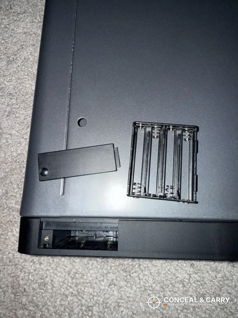 Open battery compartment on the underside of the FTOP clock gun safe