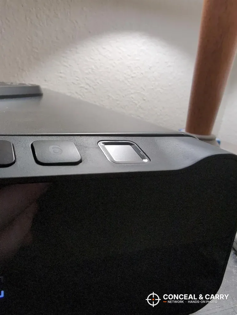 Close-up of the FTOP front edge with keypad buttons and the fingerprint reader