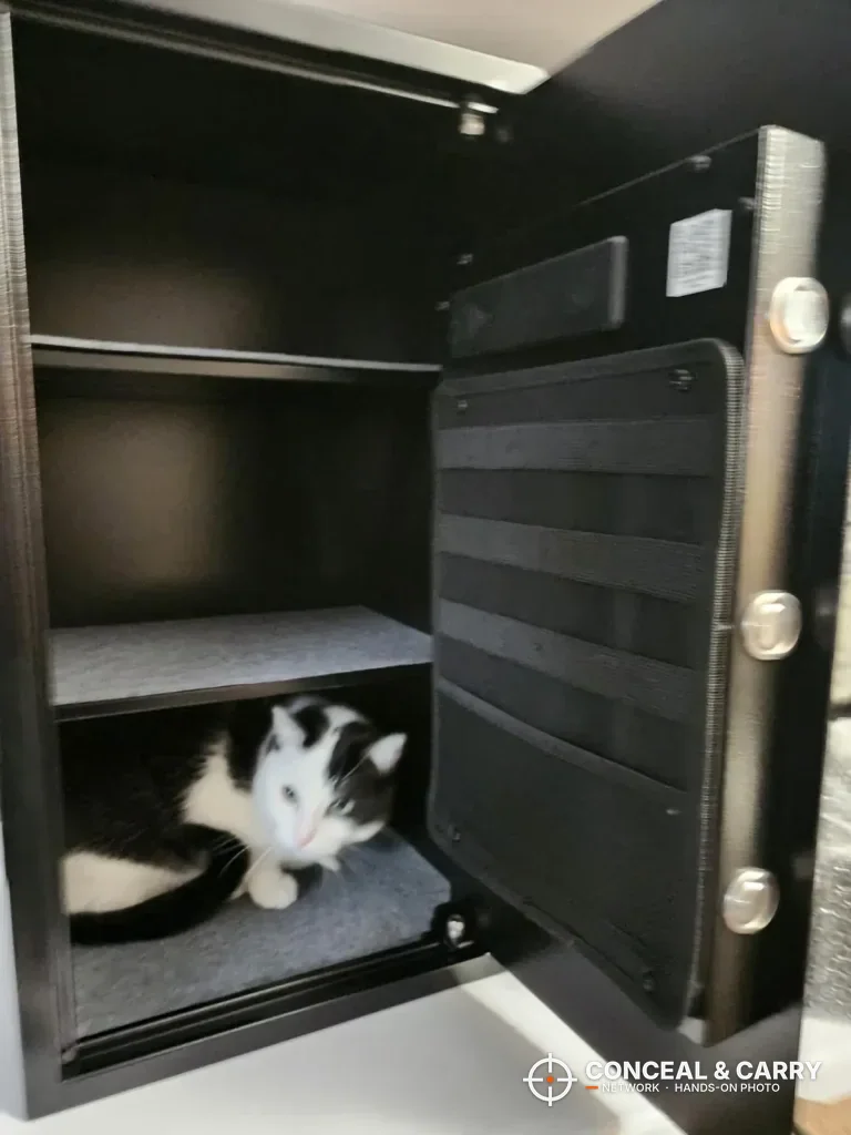 Grimtron 4-pistol safe open with the door organizer panel and removable shelf