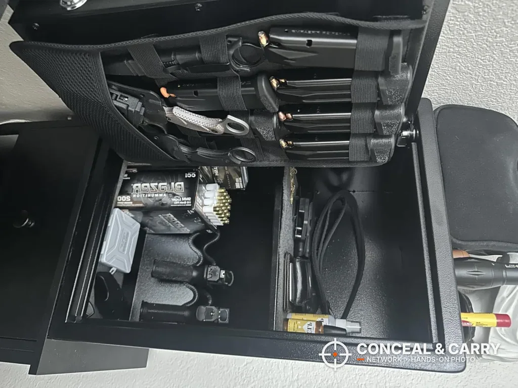 Magazines in the Grimtron 4-pistol safe door organizer with ammunition and gear inside