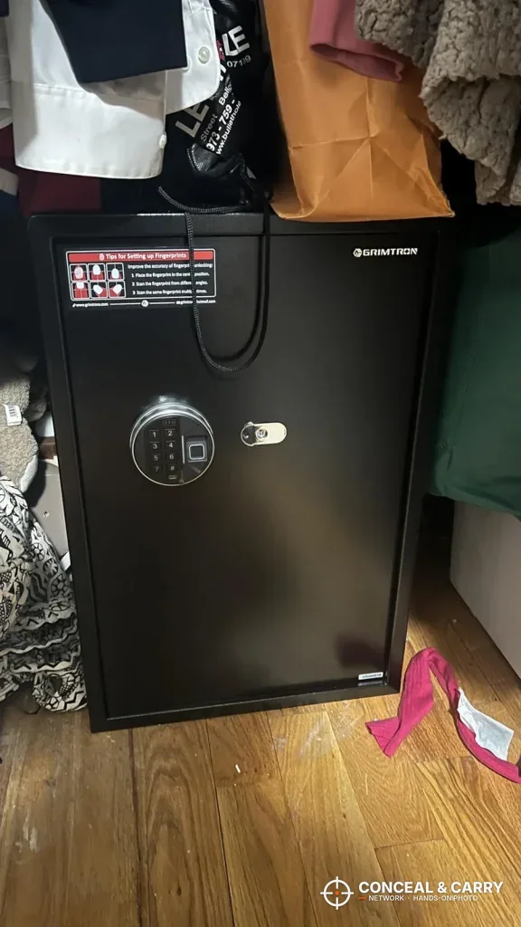 Grimtron 4-pistol safe standing on a wood floor