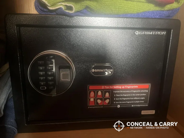 Grimtron 4-pistol biometric safe front panel with keypad, fingerprint reader and setup label