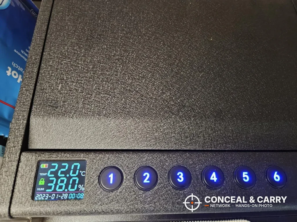 Close-up of the Grimtron heavy-duty safe keypad with a small screen beside the buttons