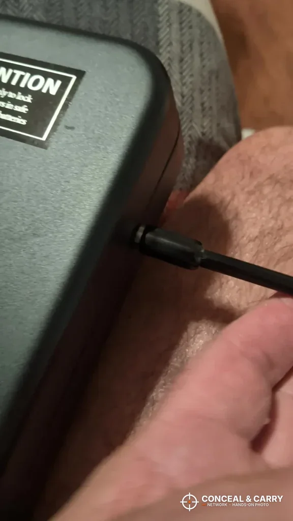 USB-C cable plugged into the side of the Grimtron portable car gun safe