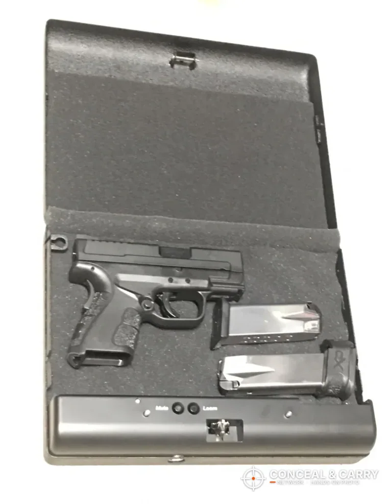 GunVault MV500 open with a compact pistol and two magazines in the foam