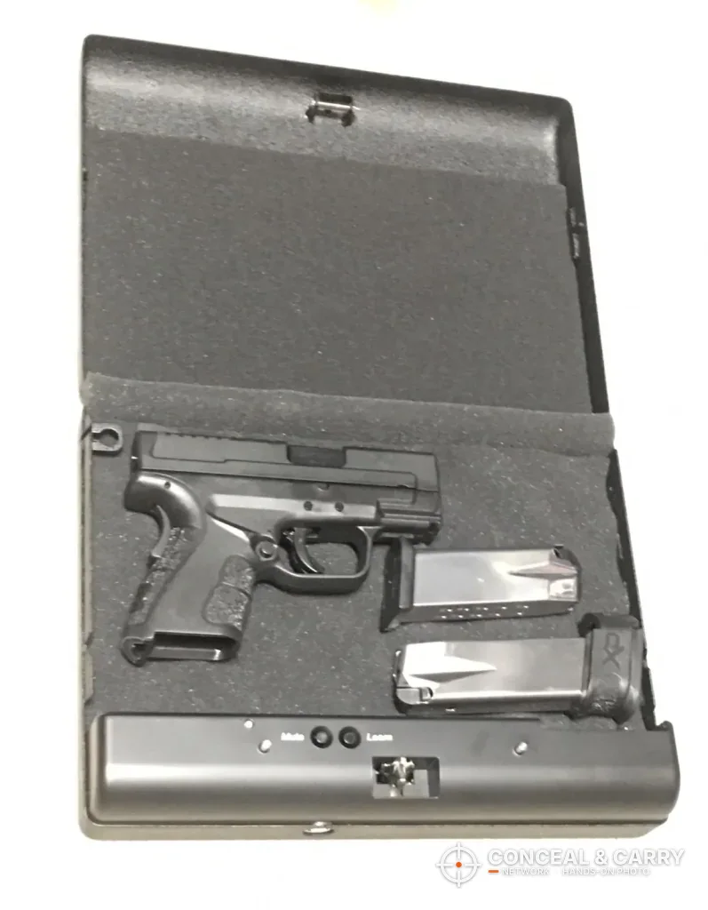 GunVault MV500 open with a compact pistol and two magazines in the foam