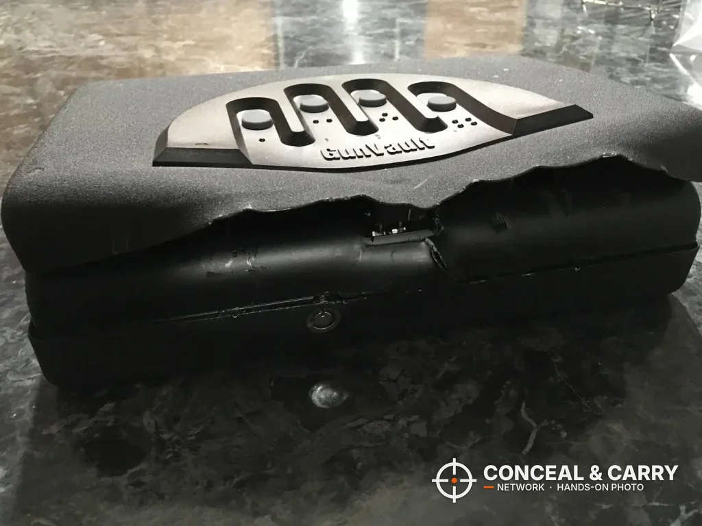 GunVault MV500 with the lid edge bent and torn back