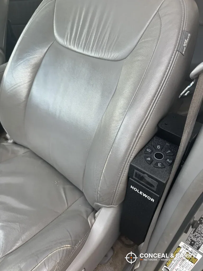 HOLEWOR drop-down safe mounted beside a car seat